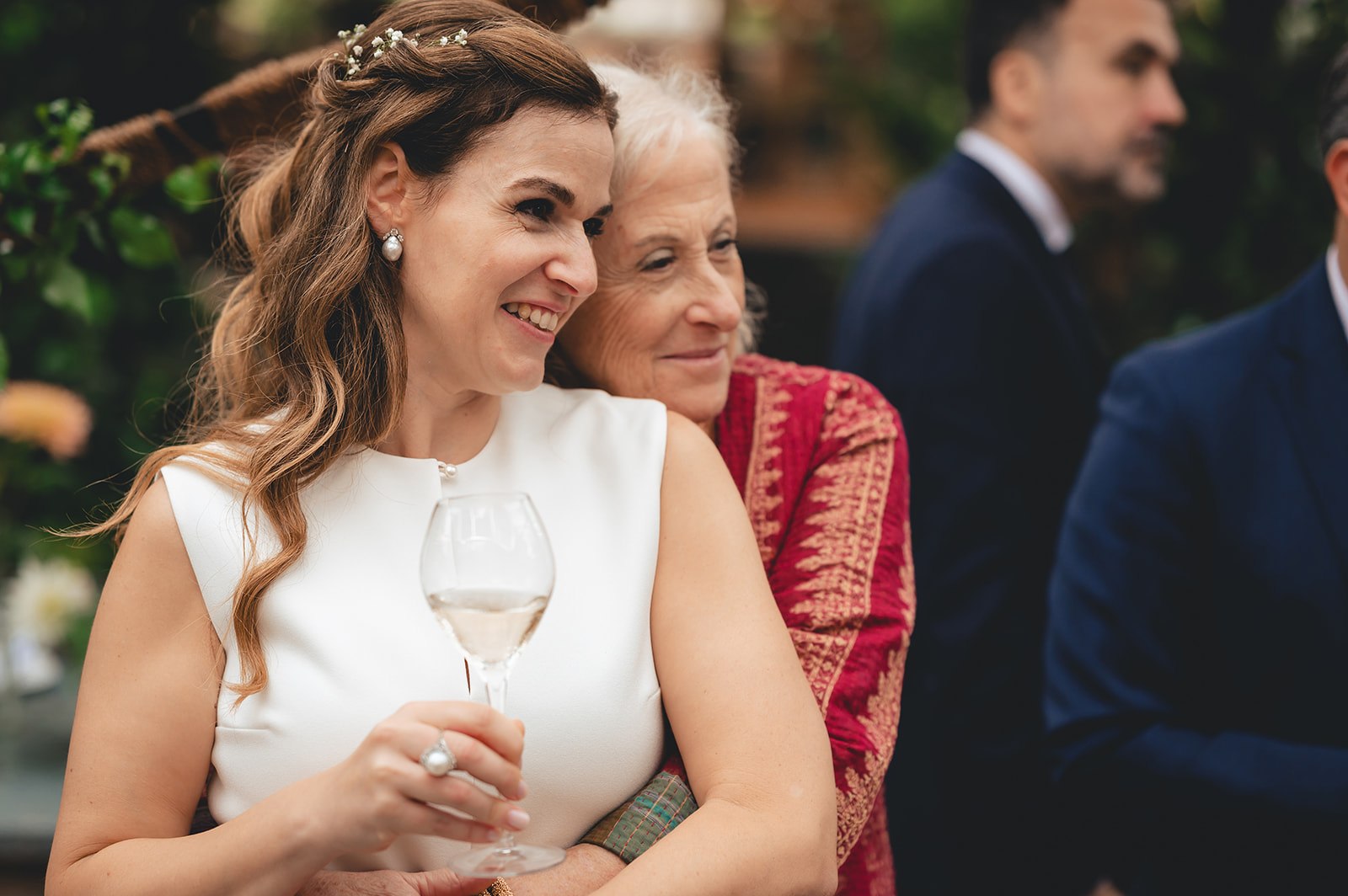 A wedding guest smiling during the celebration