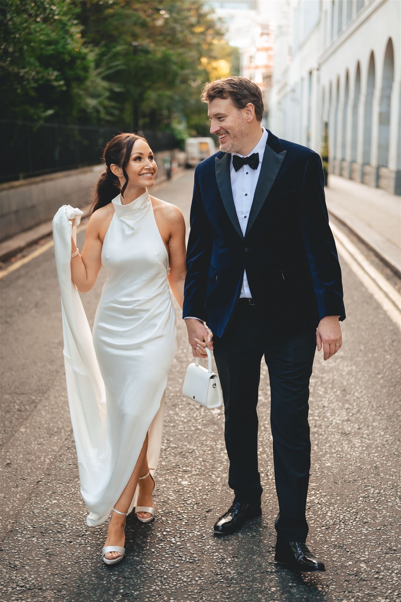 Alyse and Cas walking hand in hand in London