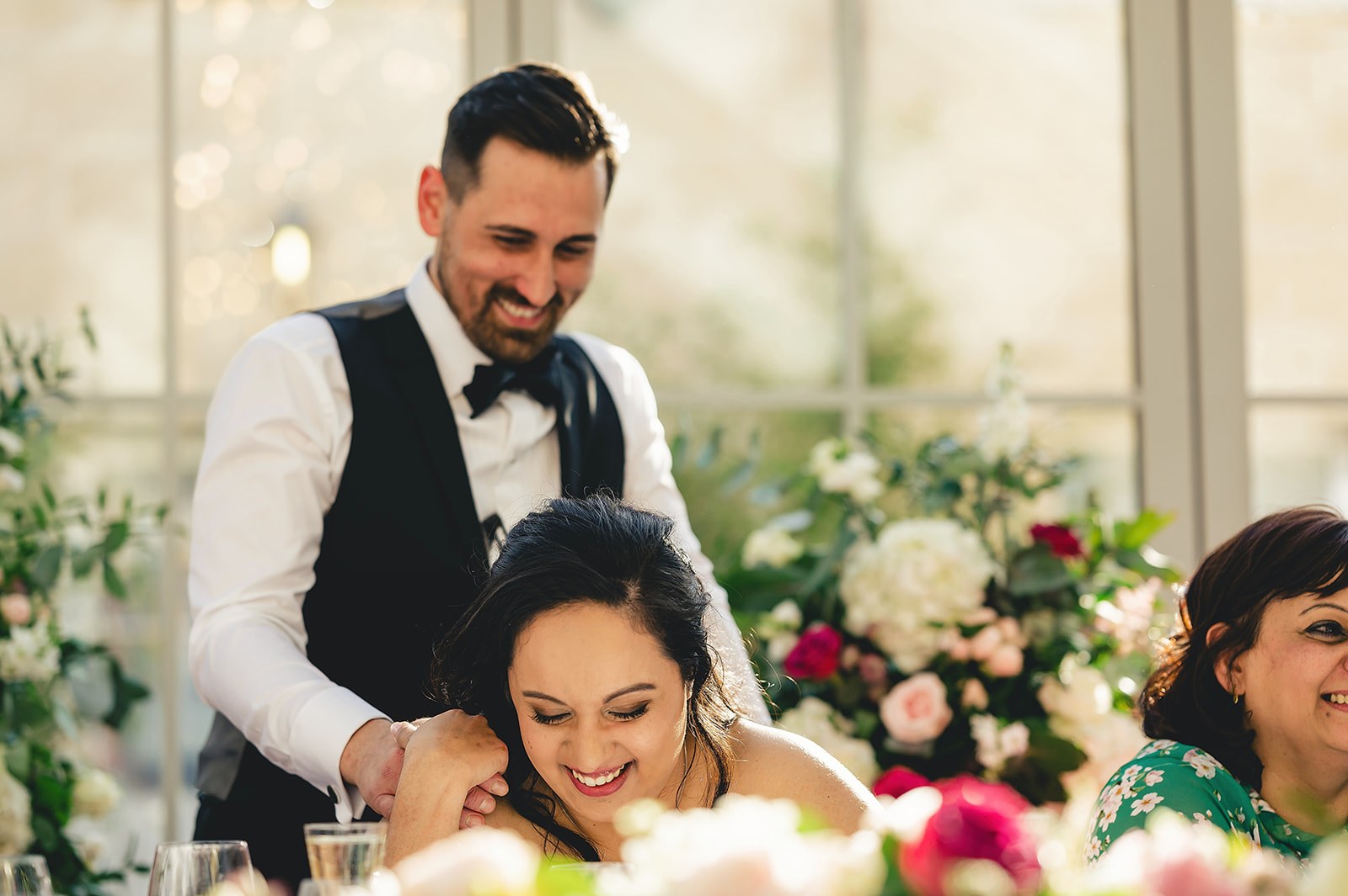 A couple sharing a happy moment during their wedding reception