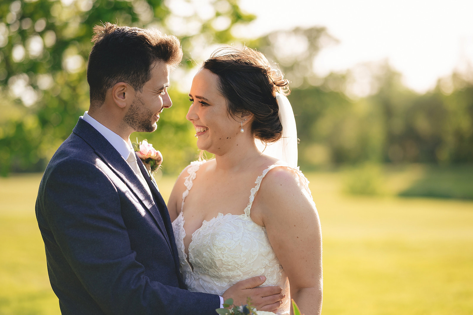 Alicia and Tyrone smiling together in the evening sunlight