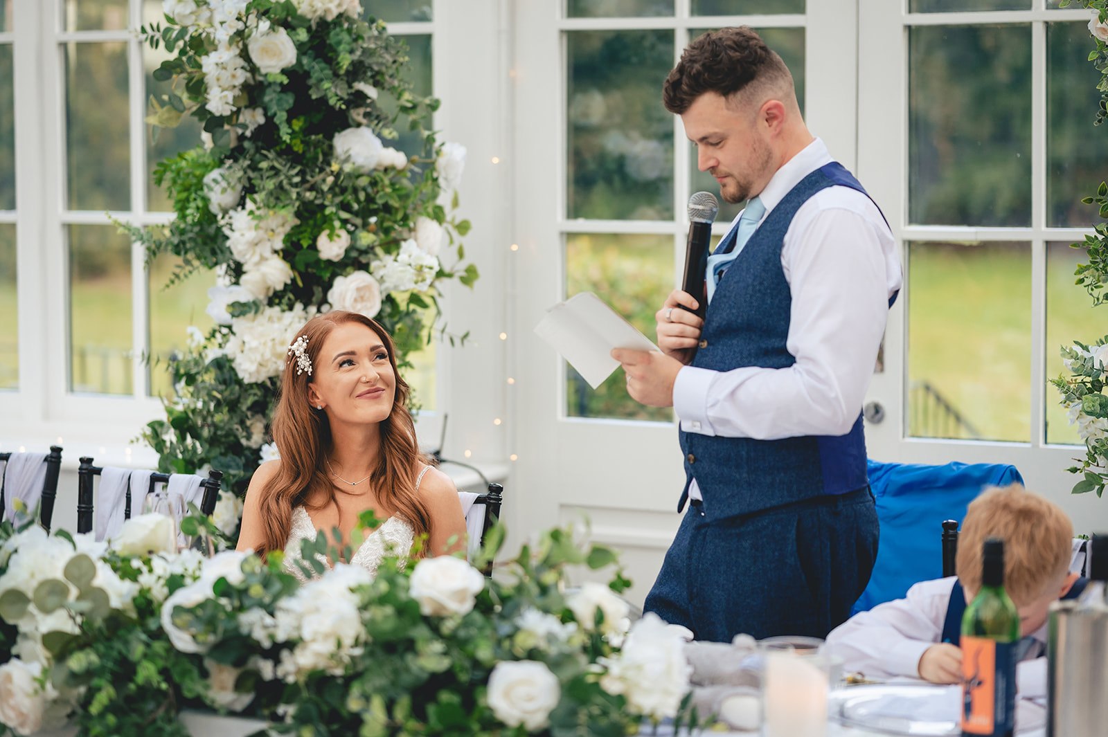 A bride looking up during a wedding speech